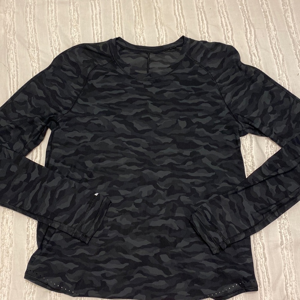 This is a Lululemon Rise and Run Long Sleeve in camo, size 6.